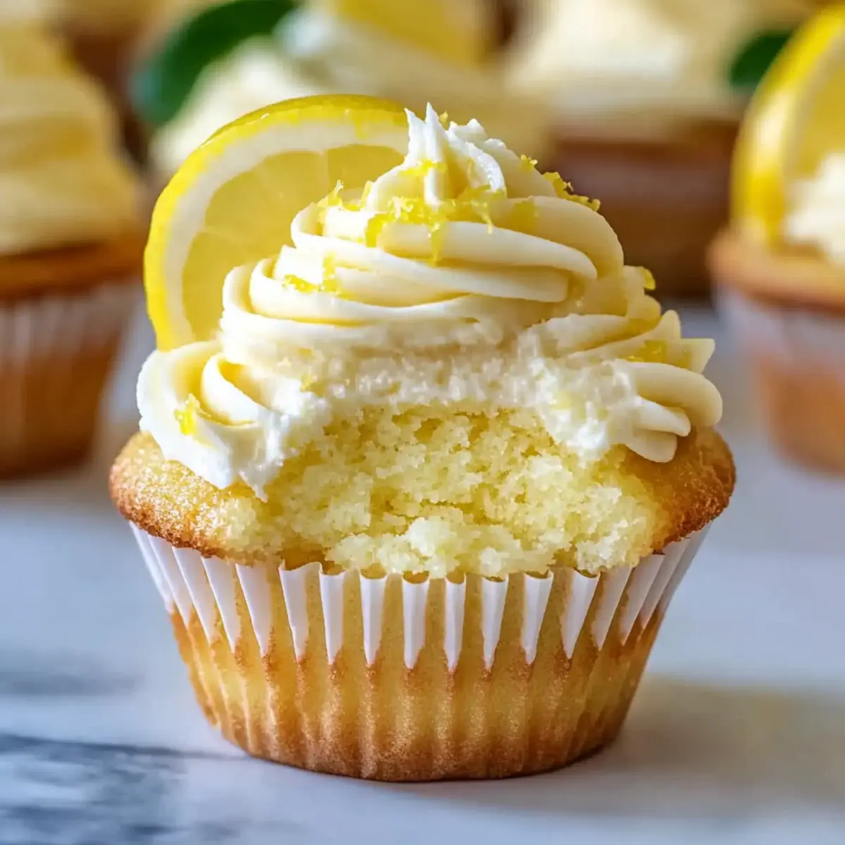 Cheesecake Stuffed Lemon Cupcakes with Lemon Frosting